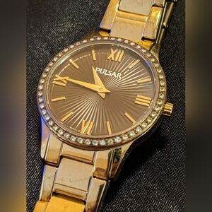 Pulsar Women's Quartz Watch Textured Brown Face Crystal Set Bezel Gold Tone